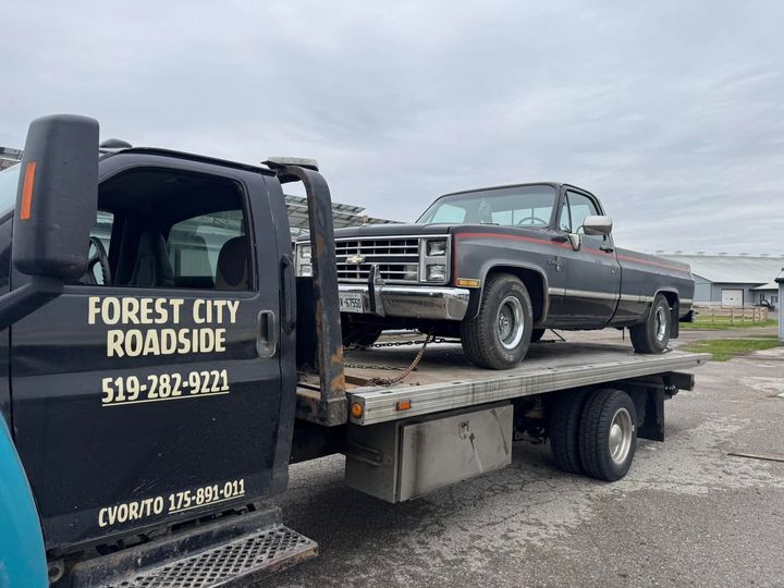 Classic pickup truck on a flatbed tow truck near Ilderton Ontario