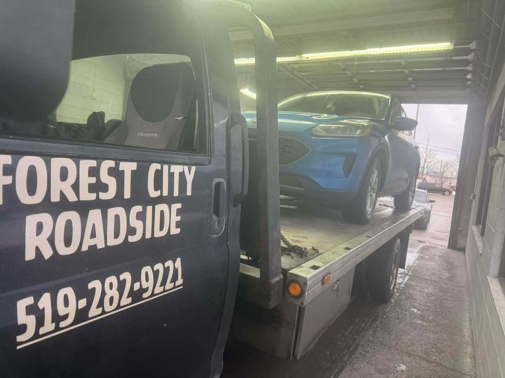 Forest City Roadside flatbed tow truck at a service garage near Mount Brydges Ontario